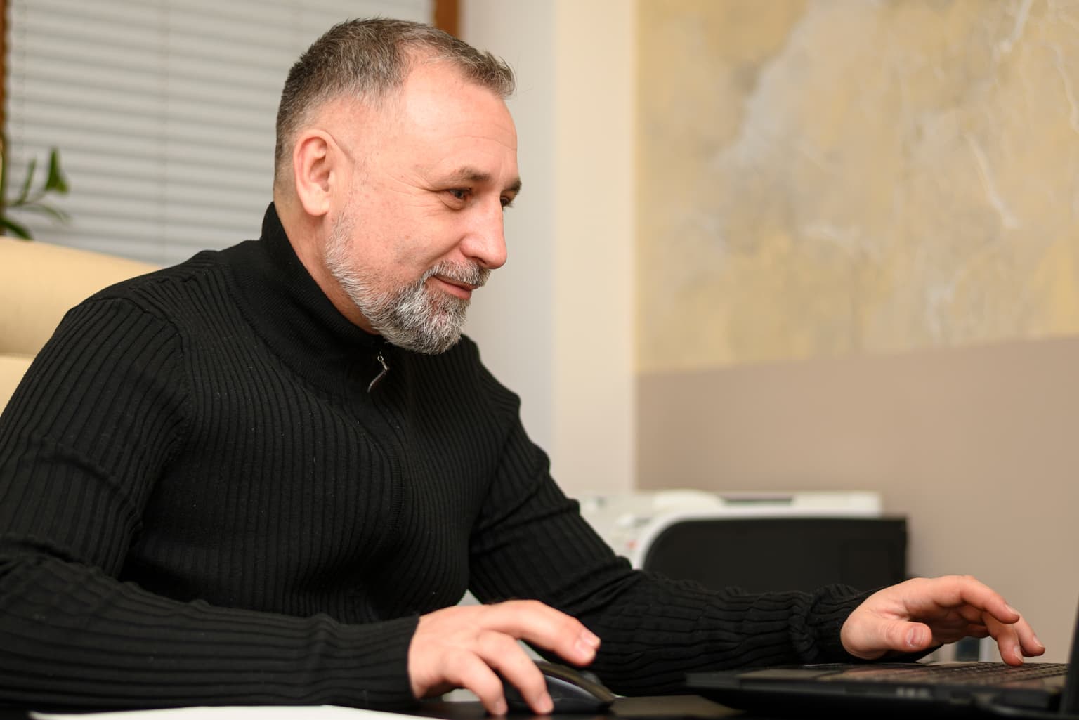Adult in their forties working comfortably without reading glasses after laser vision correction